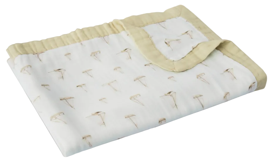 Baby blanket with dandelion pattern on a gray background